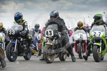 Riders wait to take their classic bikes out onto the circuit, Silverstone Classic, 2010