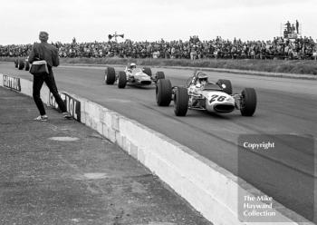 Ronnie Peterson, Tecno 69, followed by Reine Wisell, Chevron B15, Silversotne, 1969 British Grand Prix meeting.
