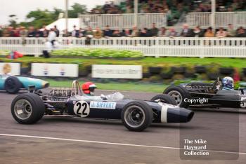 Geoff Farmer, Rob Walker Lotus 49B, leaves the grid alongside Paul Ingram's BRM P126, Glover Trophy, Goodwood Revival, 1999.
