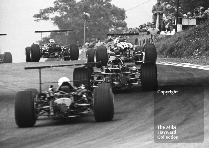 Jo Siffert, Lotus 49, leads through South Bank Bend followed by Chris Amon, Ferrari 312 V12, British Grand Prix, Brands Hatch, 1968.
