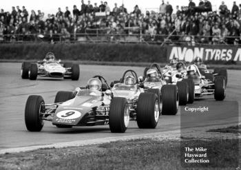 Bev Bond, Ensign LNF1, followed by Barrie Maskell, Chevron B18, and Freddy Kottulinsky, Lotus 69, GKN Forgings Trophy, International Trophy meeting, Silverstone, 1971.
