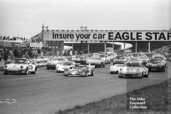 Starting grid - Mike Franey, Porsche Carrera, Louis Lorenzini, Ferrari 312P, and Larry Perkins, Porsche 911, Philips Car Radio Ferrari/Porsche race, F2 International meeting, Thruxton, 1977.
