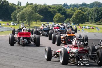 Formula Fords swarm out of Old Hall at the 2017 Gold Cup, Oulton Park.