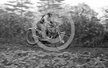 Rider takes off, Hatherton Hall Farm motocross, Nantwich, 1967