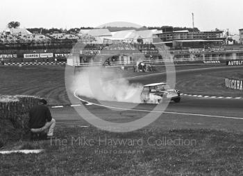 John Rhodes, Cooper Car Company Mini Cooper S, smoking through South Bank Bend during practice, Brands Hatch, Grand Prix meeting 1968.
