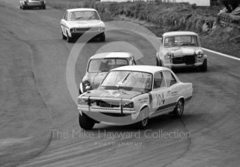 Gerry Marshall, Vauxhall Viva GT, followed by Brian Chatfield, Mini, and Bob Fox, Mini, Lodge Corner, Oulton Park, 1969
