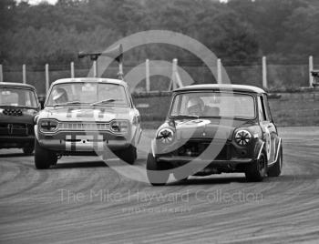 Richard Longman, JanSpeed Engineering Mini Cooper S, and Alec Peer, Dagenham Motors Ford Escort, at Becketts Corner, Silverstone Martini International Trophy 1968.

