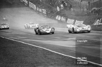 Paul Vestey, Roy Pike, Porsche 910, Jo Siffert, Brian Redman, Porsche 917, followed by Mike Beuttler, Nick Gold, Porsche 910 and Jo Bonnier, Reine Wisell, Lola T70,1970 BOAC 1000k, Brands Hatch.
