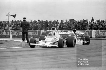 Denny Hulme, McLaren M23, followed by Clay Regazzoni, BRM P160E, Silverstone, 1973 International Trophy.
