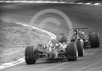 Jochen Rindt, Brabham BT26, leads Vic Elford, Cooper T86, at South Bank Bend, British Grand Prix, Brands Hatch, 1968.
