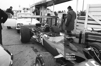 Pete Lovely's Lotus Ford 49B and a Triumph 2000 queue for the petrol pumps, Brands Hatch, 1969 Race of Champions.
