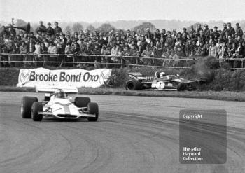 Jackie Stewart, Tyrrell DFV 003, inspects the bank at Copse Corner as Pedro Rodriguez, BRM P160, goes past during the Silverstone International Trophy 1971.
