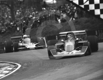 Jacky Ickx, Wolf Williams FW05, leads Tom Pryce, Shadow Ford DN5, into Druids Hairpin at the Race of Champions, Brands Hatch, 1976.
