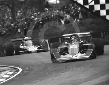 Jacky Ickx, Wolf Williams FW05, leads Tom Pryce, Shadow Ford DN5, into Druids Hairpin at the Race of Champions, Brands Hatch, 1976.
